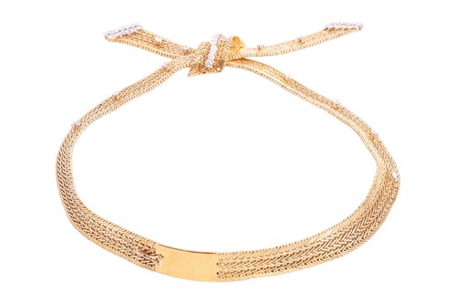 Lot 171 - Kutchinsky - a diamond-set bow necklace, set...