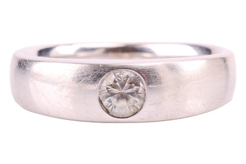 Lot 84 - A white sapphire gypsy ring, flush-set with a...