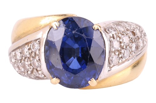 Lot 120 - A gem-set dress ring, centred with an oval-cut...