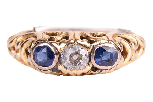 Lot 252 - A diamond and sapphire half hoop ring, centred...