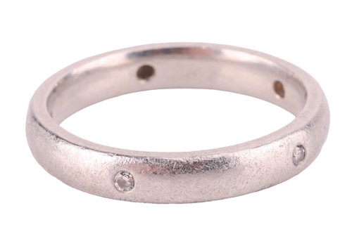 Lot 112 - A diamond-set wedding band in platinum, the...