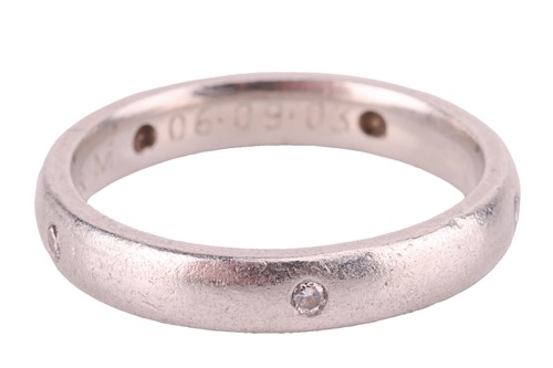Lot 112 - A diamond-set wedding band in platinum, the...