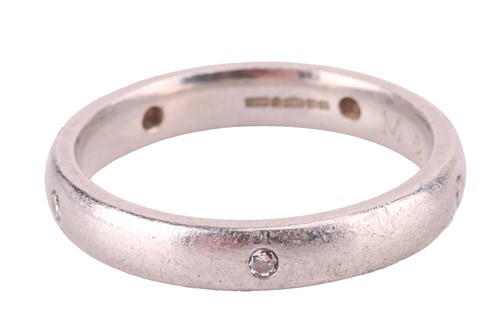 Lot 112 - A diamond-set wedding band in platinum, the...