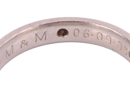 Lot 112 - A diamond-set wedding band in platinum, the...