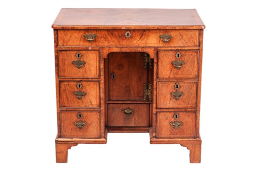 Lot 85 - A walnut lady's kneehole desk, early 18th...