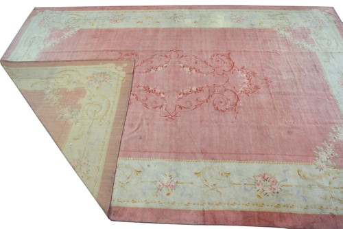 Lot 142 - A muted red/pink ground Austrian Savonerie...