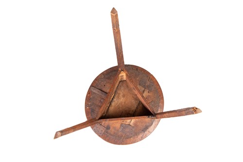 Lot 133 - An early 19th-century rustic elm cricket table...