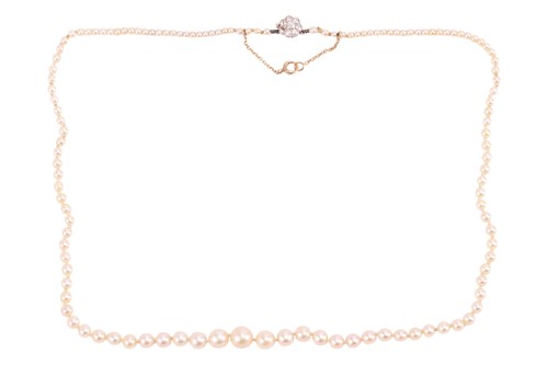 Lot 202 - A graduated pearl necklace with diamond...
