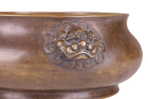 Lot 63 - A Chinese Ming Dynasty style patinated bronze...