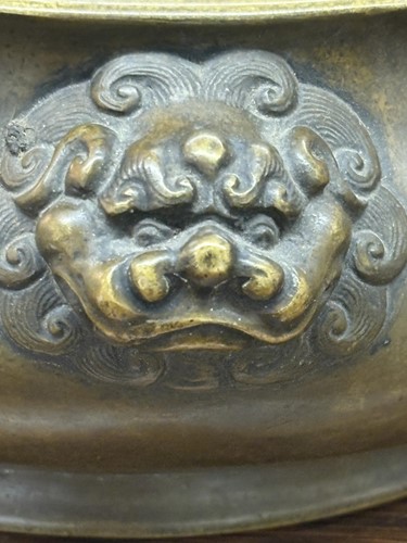 Lot 63 - A Chinese Ming Dynasty style patinated bronze...
