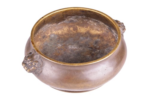 Lot 63 - A Chinese Ming Dynasty style patinated bronze...