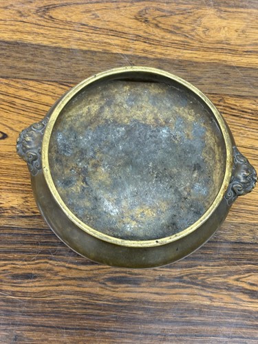 Lot 63 - A Chinese Ming Dynasty style patinated bronze...