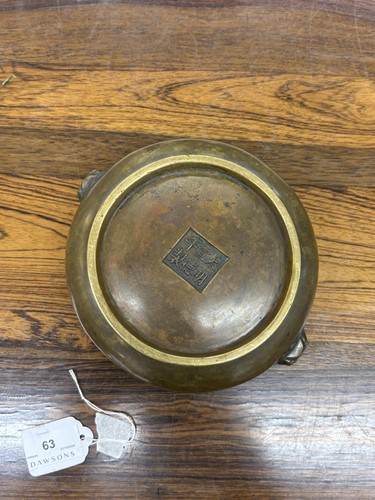 Lot 63 - A Chinese Ming Dynasty style patinated bronze...