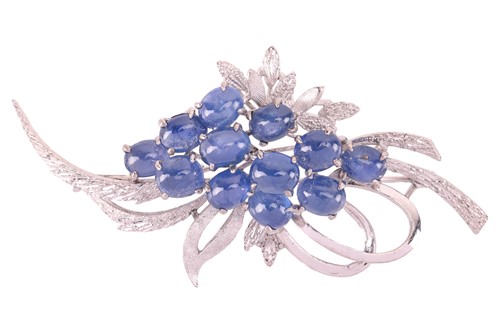 Lot 71 - A sapphire cabochon spray brooch, of foliate...