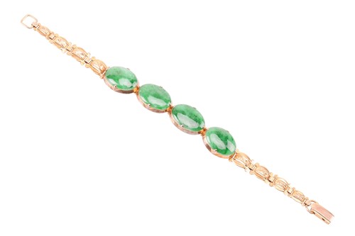 Lot 197 - A jade link bracelet, comprising four oval...