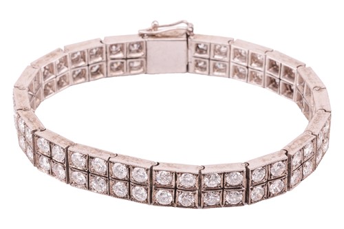 Lot 118 - A double-row diamond-set line bracelet,...