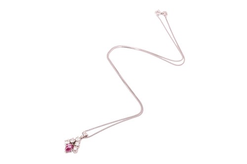Lot 21 - A star ruby and diamond-set cluster pendant,...
