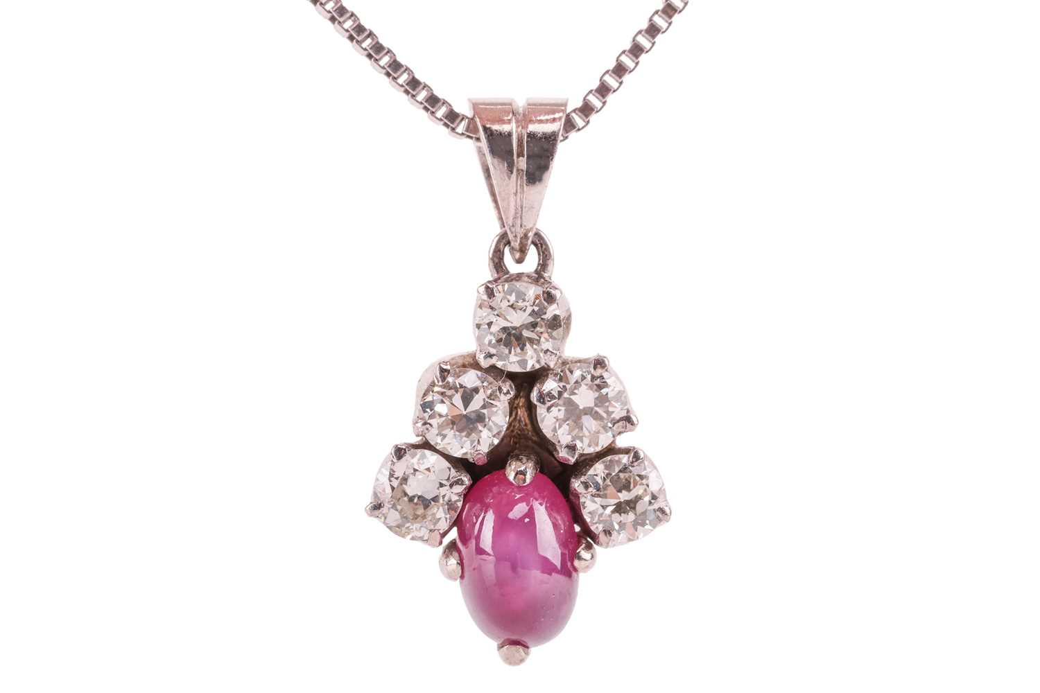 Lot 21 - A star ruby and diamond-set cluster pendant,...