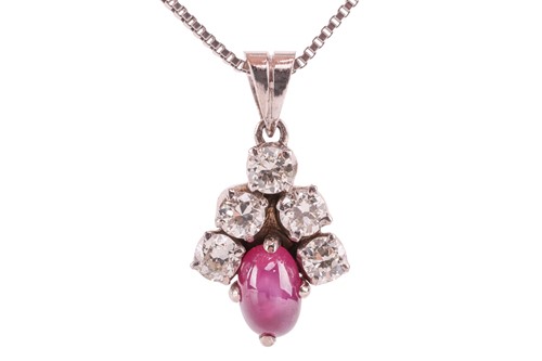 Lot 21 - A star ruby and diamond-set cluster pendant,...