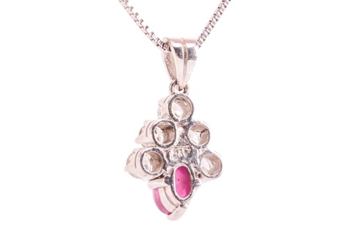 Lot 21 - A star ruby and diamond-set cluster pendant,...