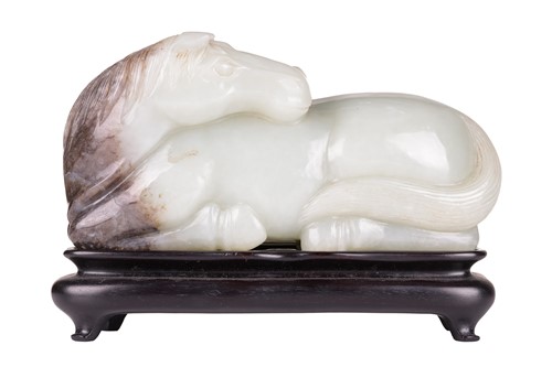 Lot 175 - A Chinese celadon green jade boulder carving...