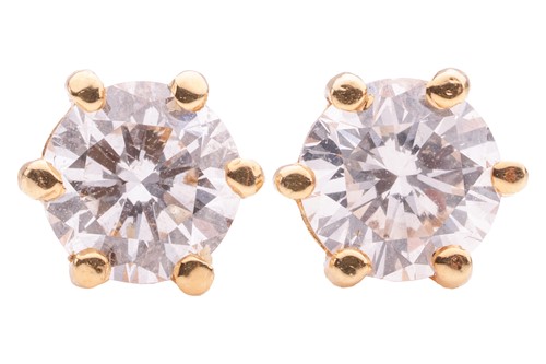 Lot 27 - A pair of diamond stud earrings, each six-claw...