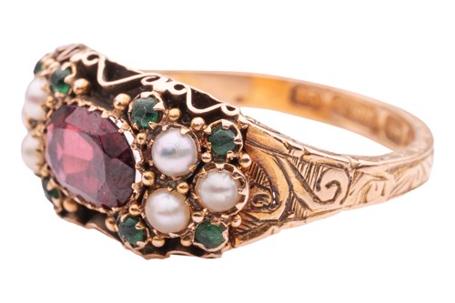Lot 1 - A gem-set ring, the central oval-shaped garnet...