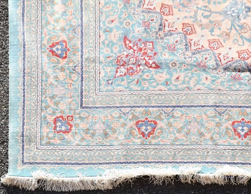Lot 69 - A large hand woven silk Nain rug with central...