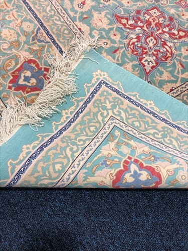 Lot 69 - A large hand woven silk Nain rug with central...