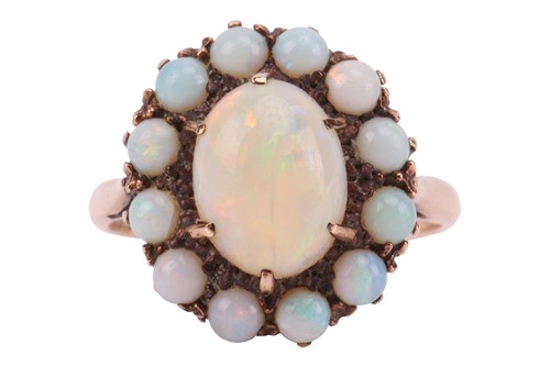 Lot 206 - An opal cluster ring, comprising an oval...