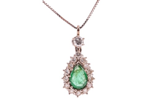 Lot 121 - An emerald and diamond cluster pendant on...
