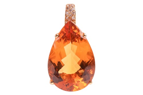 Lot 208 - A large citrine pendant, featuring a large...