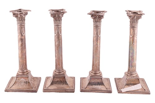 Lot 355 - A set of four George III column candlesticks,...