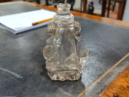 Lot 76 - A Chinese-carved rock crystal snuff flask and...