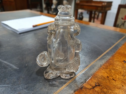 Lot 76 - A Chinese-carved rock crystal snuff flask and...