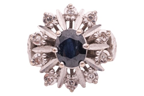 Lot 154 - A sapphire and diamond-set cluster ring, the...
