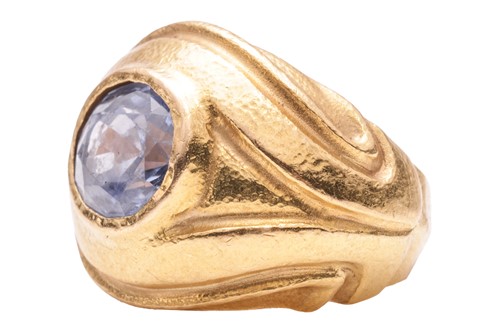 Lot 125 - A sapphire dress ring, centred with an...