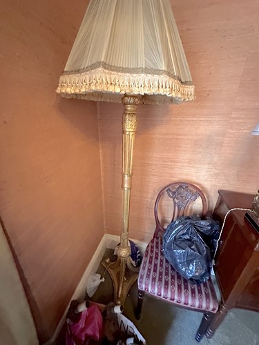 Lot 139 - A carved wood and gilt gesso standard lamp...