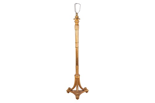 Lot 139 - A carved wood and gilt gesso standard lamp...