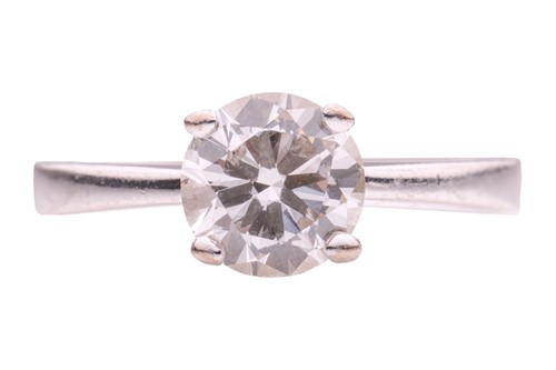 Lot 227 - A diamond solitaire ring in platinum,...