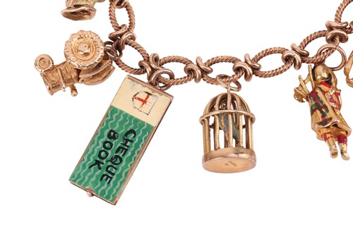 Lot 16 - A 9ct gold charm bracelet, comprising a cable...