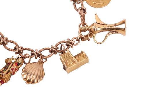 Lot 16 - A 9ct gold charm bracelet, comprising a cable...