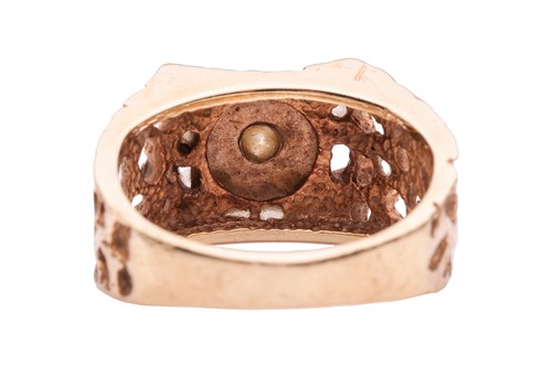 Lot 5 - A Modernist-style dress ring, featuring a...