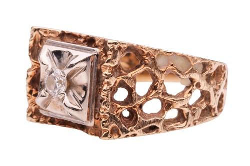 Lot 5 - A Modernist-style dress ring, featuring a...