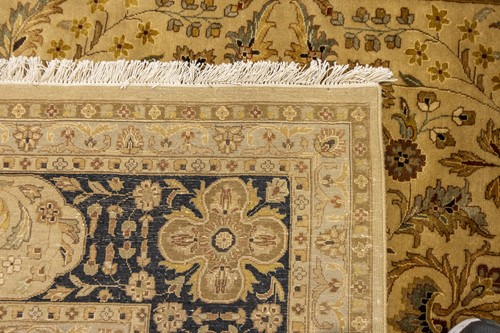 Lot 146 - An Indian ivory ground "Agra" carpet,...