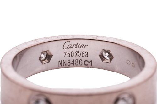 Lot 38 - Cartier - an 18ct white gold 'Love' ring set...