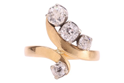 Lot 158 - A diamond bypass ring, set with four graduated...