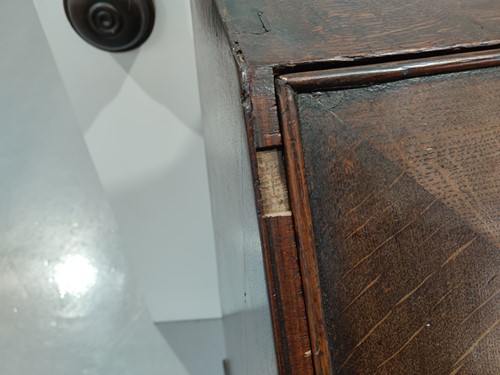 Lot 123 - A George I and later oak writing bureau, the...