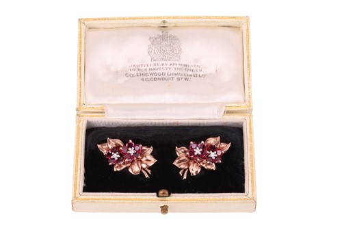 Lot 128 - A pair of floral spray earrings set with a...