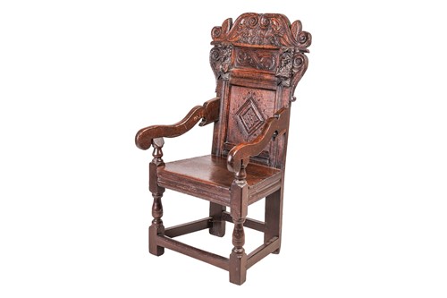 Lot 75 - A Charles II and later oak wainscot armchair...